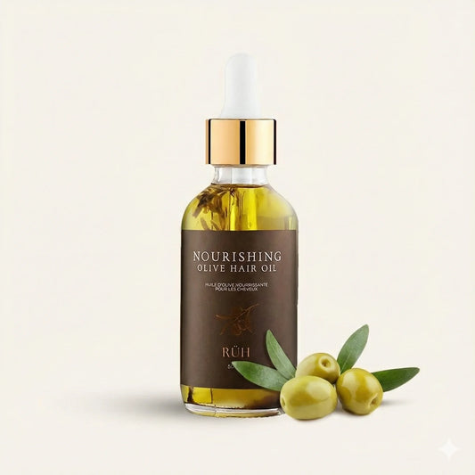 Bottle of Olive hair oil with olives and leaves on a beige background