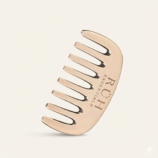 Rose gold Bronze comb on a beige background