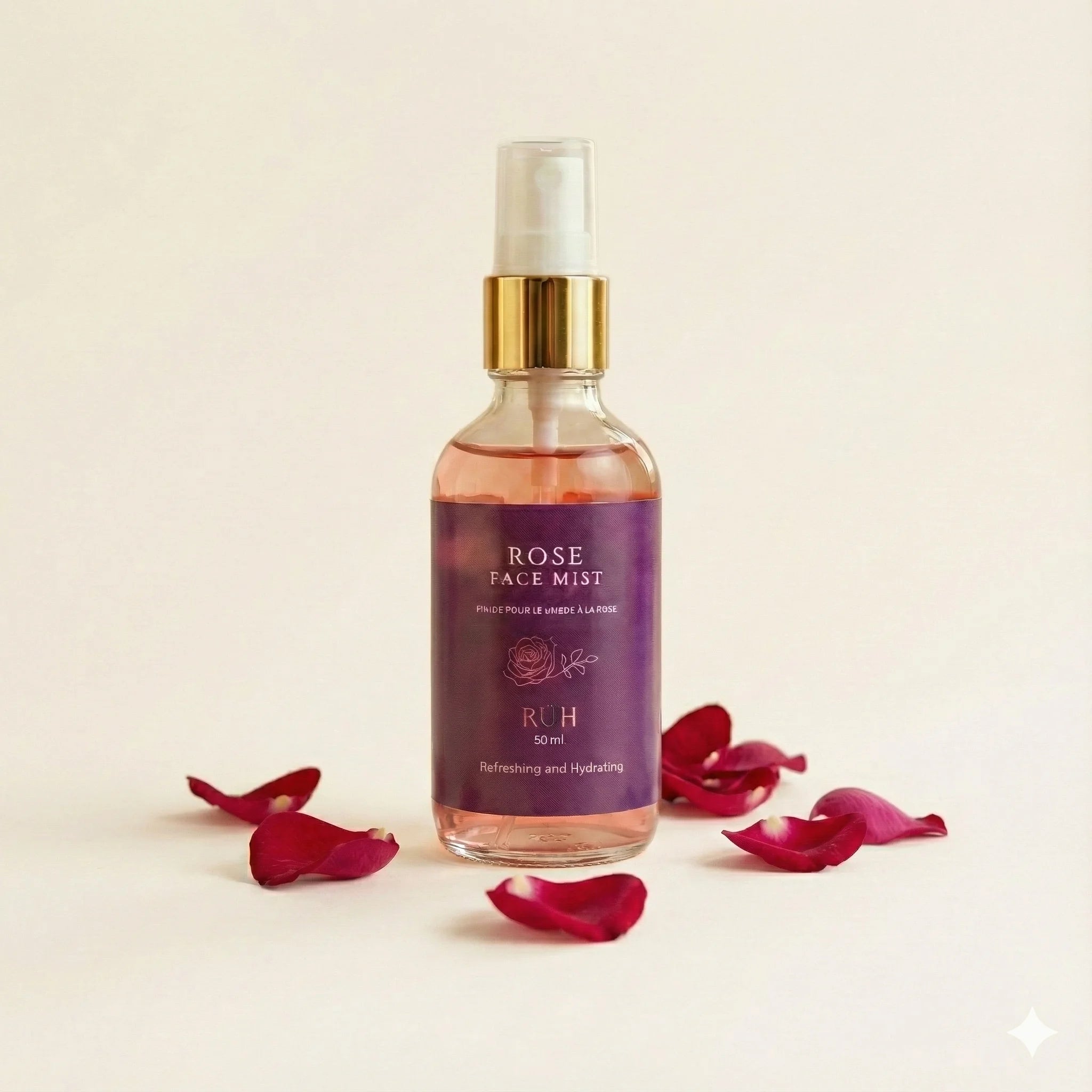 Rose face mist bottle with red rose petals on a beige background