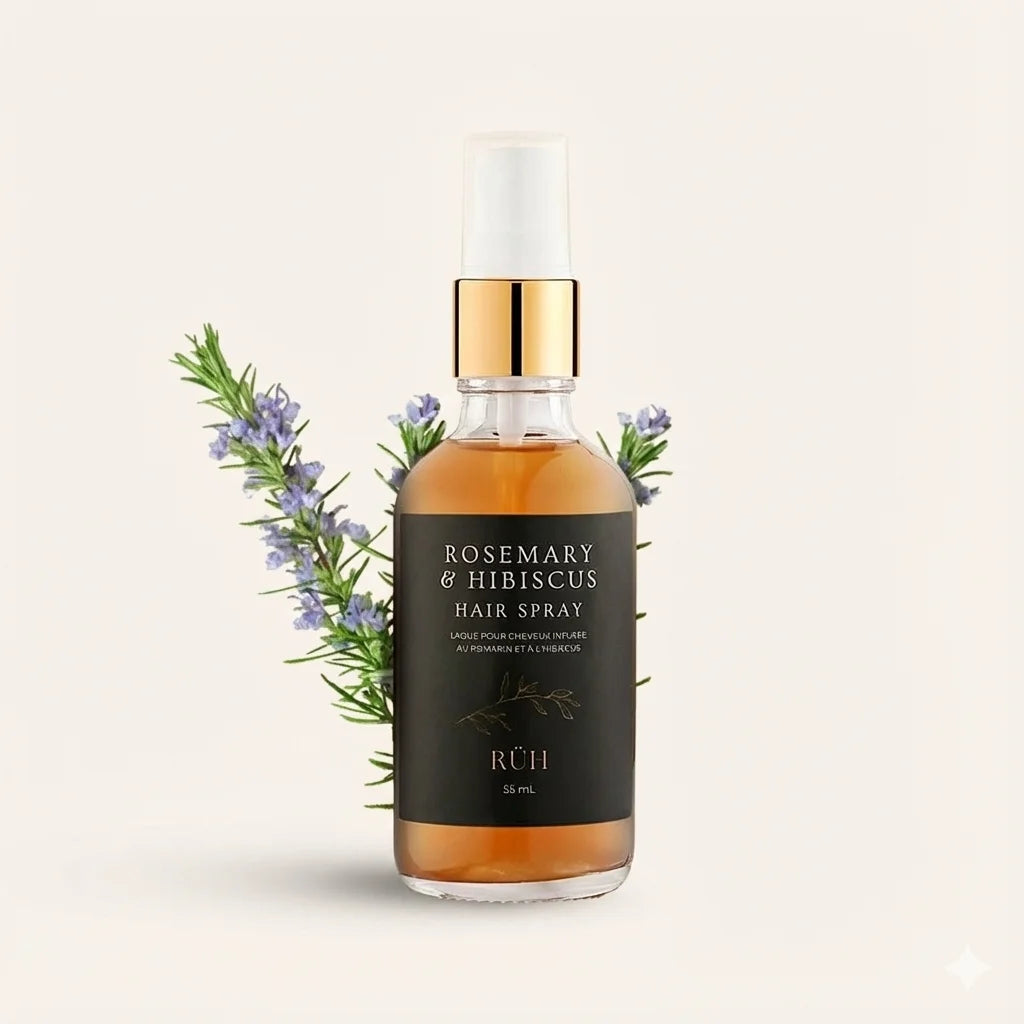 Rosemary & Hibiscus hair spray bottle with gold cap on a light beige background