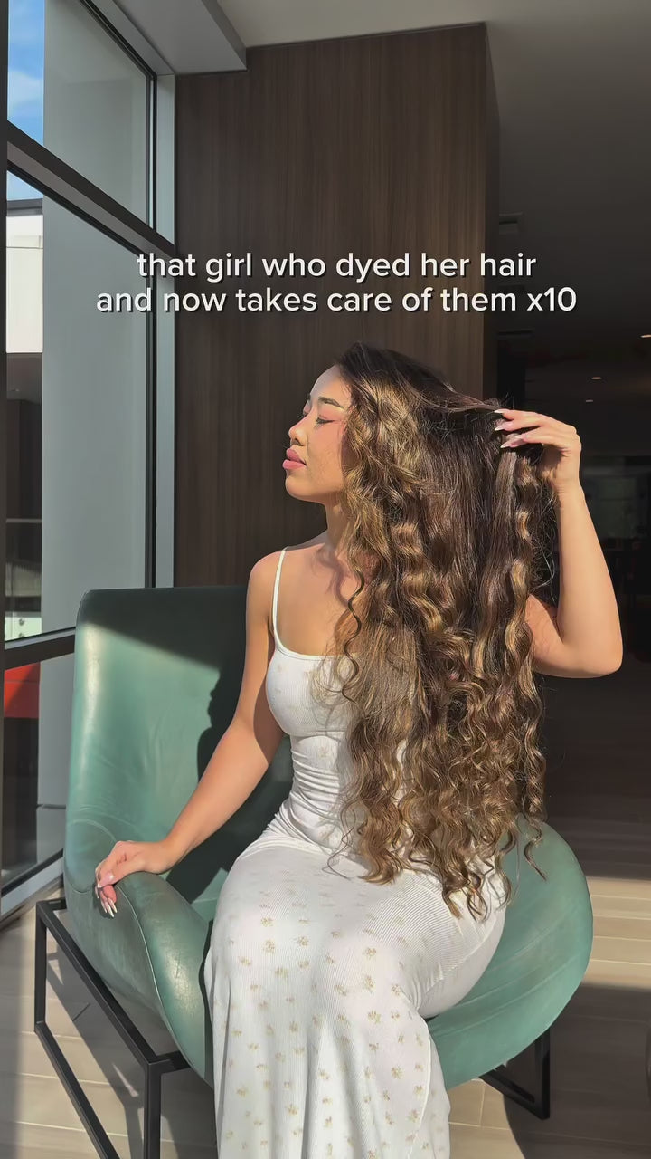 An influencer showing the impact of using Ruh Essentials hair products on her hair.