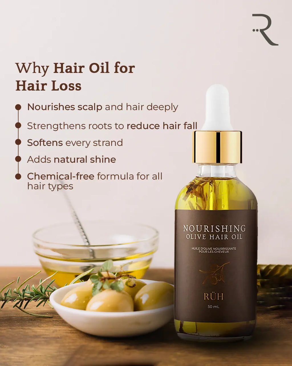 Bottle of Nourishing Olive Hair Oil with olive branches and oil on a wooden surface